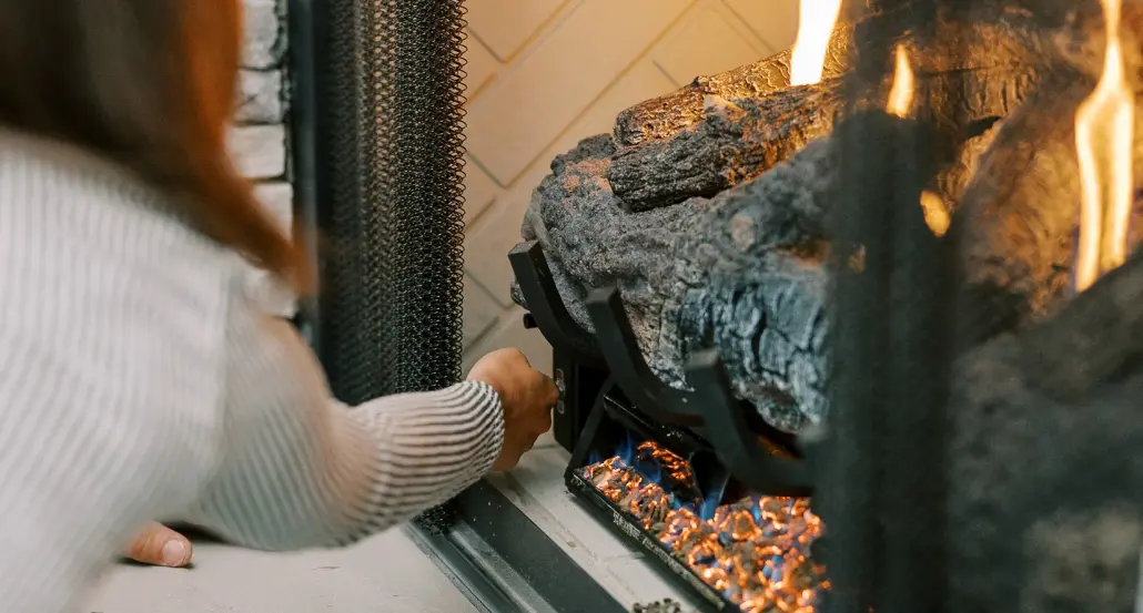 Residential Hall customer lighting a propane gas fireplace