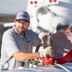 Propane delivery specialist filling a tank