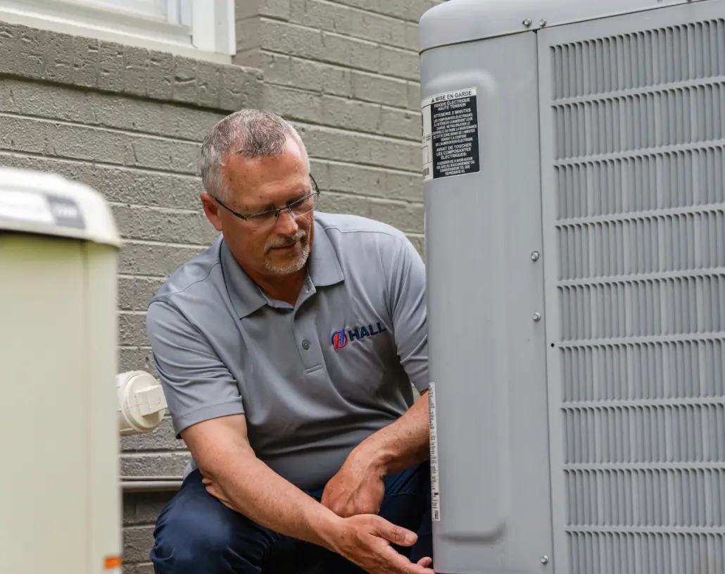DSC04055 Hall HVAC technician working on an outdoor unit