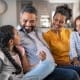 family sitting on couch together